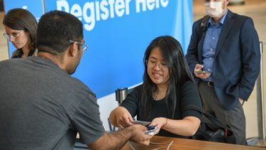 woman registering badge