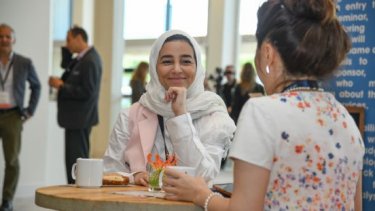 women networking at table